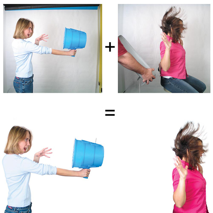 A blonde girl shooting air from a blue plastic device at a brunette's hair, comped together from two images, one using a fan to blow the brunette's hair.