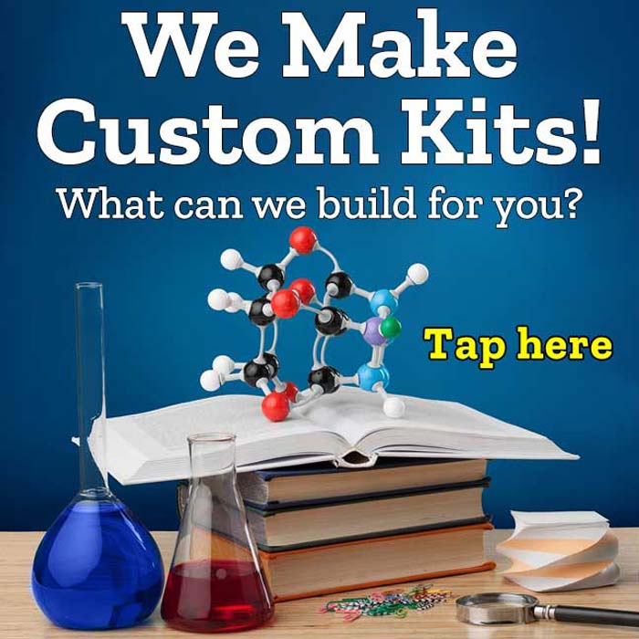 We Make Custom Kits! What can we build for you? Molecule model on books with beakers of liquid